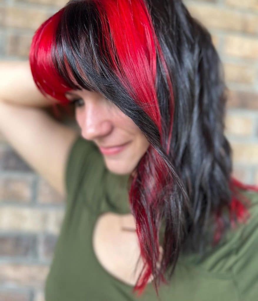 Woman with red color blocking in her hair
