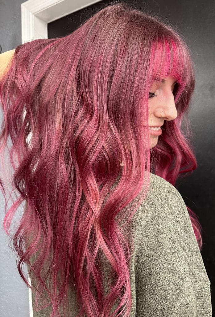 Woman with long pink hair