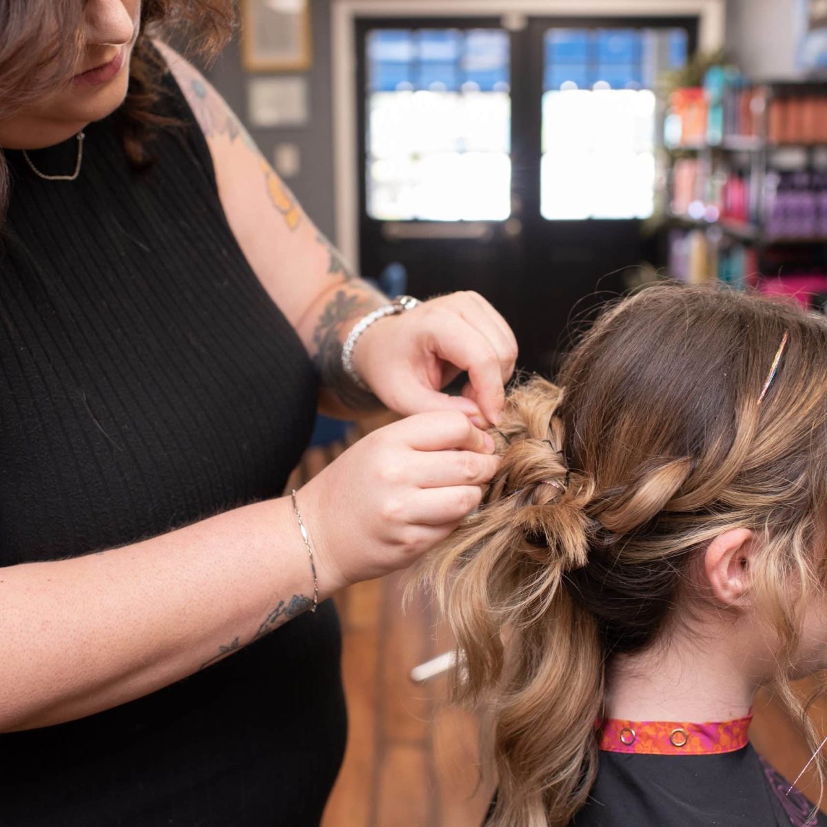 hairstylist doing an updo