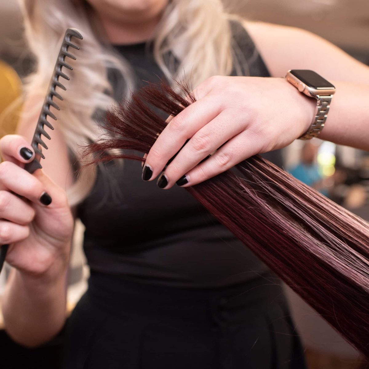 Hairstylist cutting a client's hair