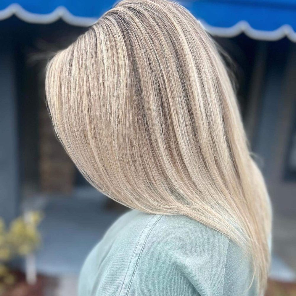Woman shows off blonde hair after salon visit